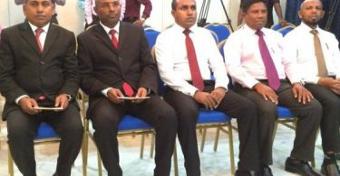 The now-suspended judge of the Criminal Court, Ahmed Rasheed (C).