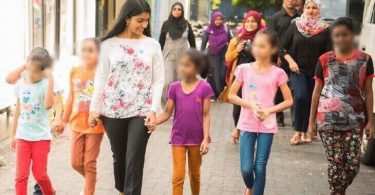Gender Minister Aminath Zeneesha Shaheed Zaki pictured with some children, heading to the recently opened Schwack Cinema in Hulhumale. PHOTO/GENDER MINISTRY