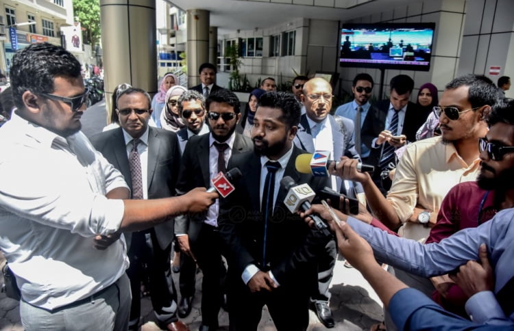 Lawyers speak to press after presenting a "great, big" Constitution to the Attorney General.