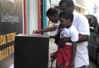 A boy puts money in a fund box placed by Raajje TV to raise aid for the persecuted Rohingya Muslims of Myanmar. PHOTO/TWITTER