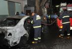 Fire fighters at the scene where Prosecutor General Aishath Bisham's car was torched. PHOTO / MNDF