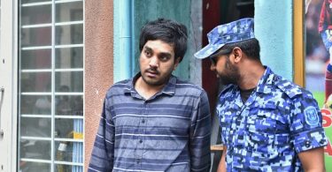 Police arrest Afrah Abdul Razzaq, 21, a suspect wanted in connection to the murder of Mohamed Anas. PHOTO: HUSSAIN WAHEED/MIHAARU