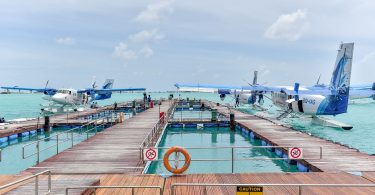 Seaplanes of Maldivian docked at Velana International Airport.