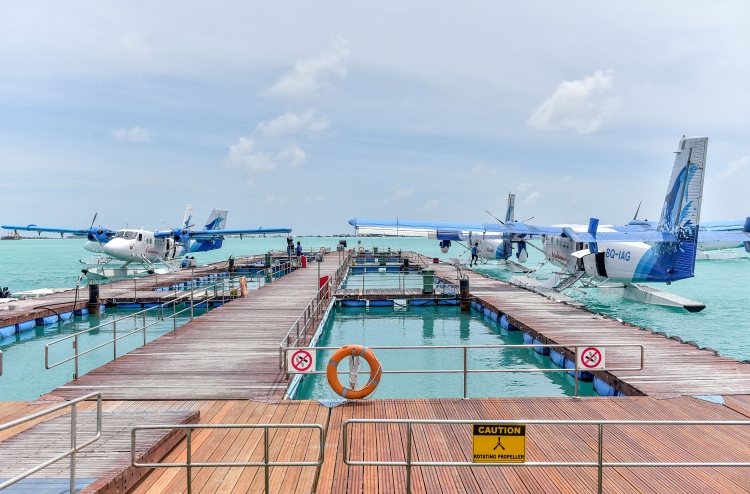 Seaplanes of Maldivian docked at Velana International Airport.