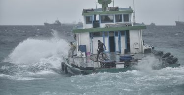 A local boat travels out of the Male harbour in rough seas. PHOTO: NISHAN ALI/MIHAARU