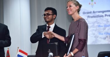 Finance minister Ahmed Munawar (L) and Embassy of Netherlands's deputy head of mission Eva Woersem sign and exchange agreement for RVO to grant USD 10.7 million for the Fuvahmulah coastal protection project.