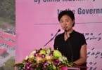 Counsellor Yang Yin of the Chinese Embassy speaks at the ceremony in which CMEC handed over 1,500 flats to the Maldivian government. PHOTO: HUSSAIN WAHEED/MIHAARU
