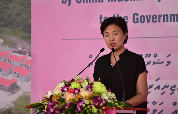 Counsellor Yang Yin of the Chinese Embassy speaks at the ceremony in which CMEC handed over 1,500 flats to the Maldivian government. PHOTO: HUSSAIN WAHEED/MIHAARU