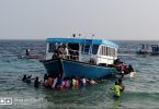 The residents of H. Dh. Kurimbi bringing ashore the boat that ran aground a reef early on January 09, 2018. The boat was en route to H. Dh. Kulhudhufishi when the incident occurred. PHOTO / ALI UWAISH