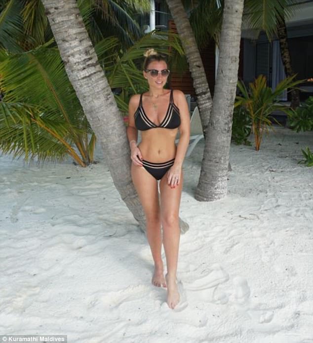 Life's a beach! In another stunning shot, the mother-of-two donned a black bikini that offered a look at her impeccably toned abs as she posed up a storm on the beach