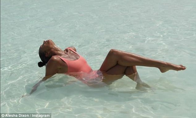 Sensational: The Britain's Got Talent judge proceeded to take a dip in the ocean, where she raised her taut legs into the air while proving to be in full relaxation mode