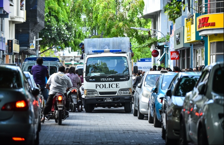 Police vehicle with riot police