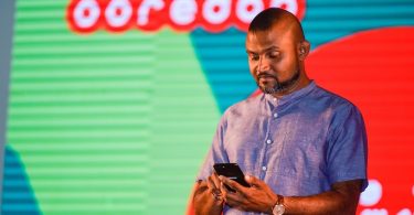 An Ooredoo executive at an application launching event
