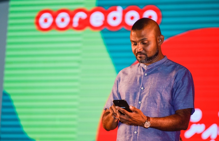 An Ooredoo executive at an application launching event