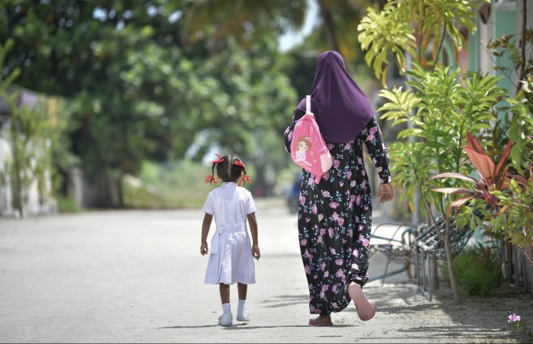 women and a child in Kanduhulhudhoo island