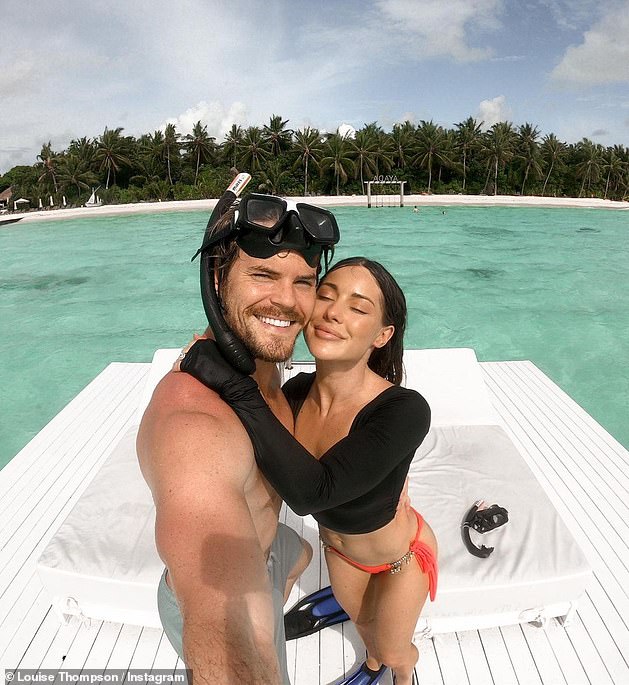 Maldives memories: Louise and her beau Ryan Libbey, also 30, also appeared in high spirits as they enjoyed a snorkelling session before relaxing on a pontoon