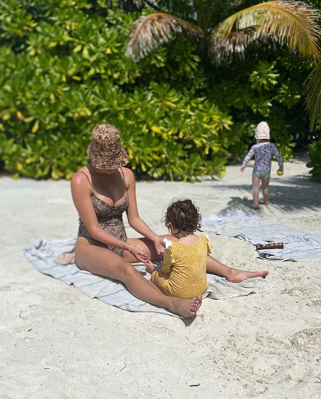 Child's play: Joanna also shared a series of happy photos of herself and her kids as they played together on the sand