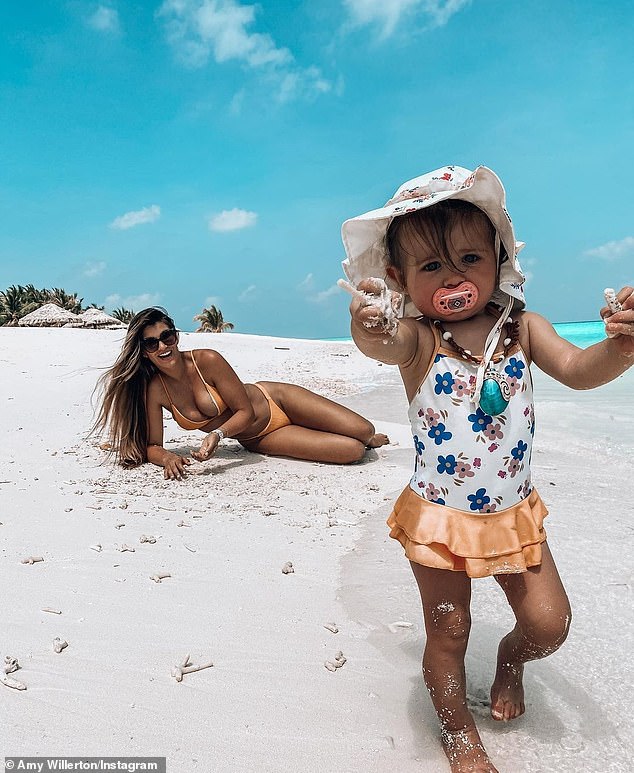 Fun and frolics: Sporting a bright orange bikini in another snap, the star was also seen frolicking on the shores with her 13-month-old daughter Demelza